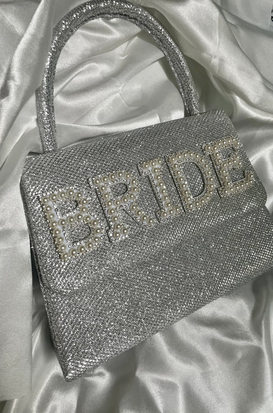 Silver glitter clutch bag