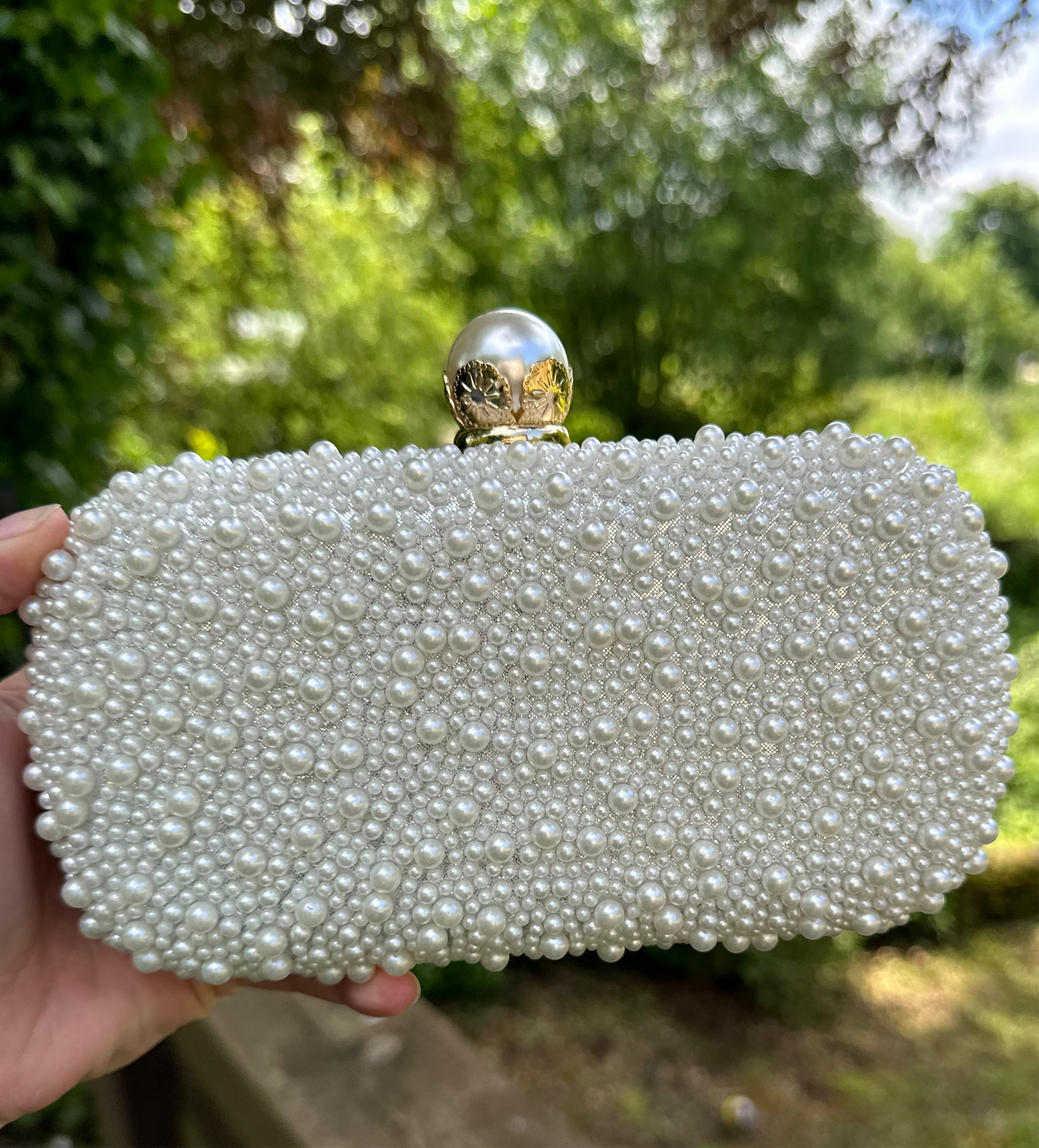 Plain pearl clutch bag