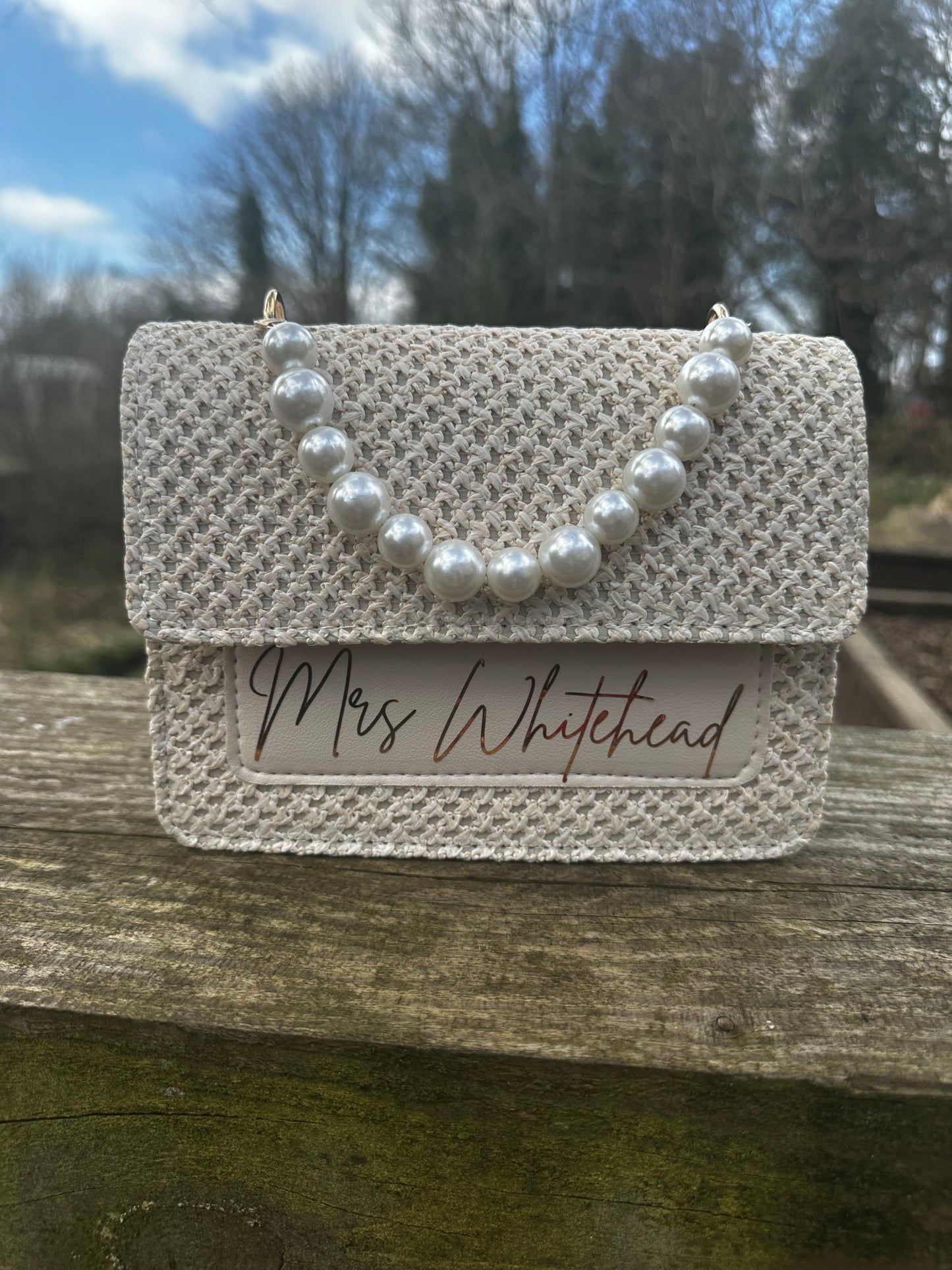Beige clutch bag