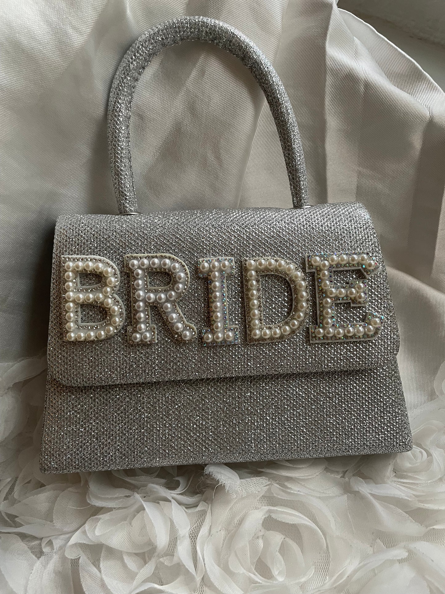 Silver glitter clutch bag