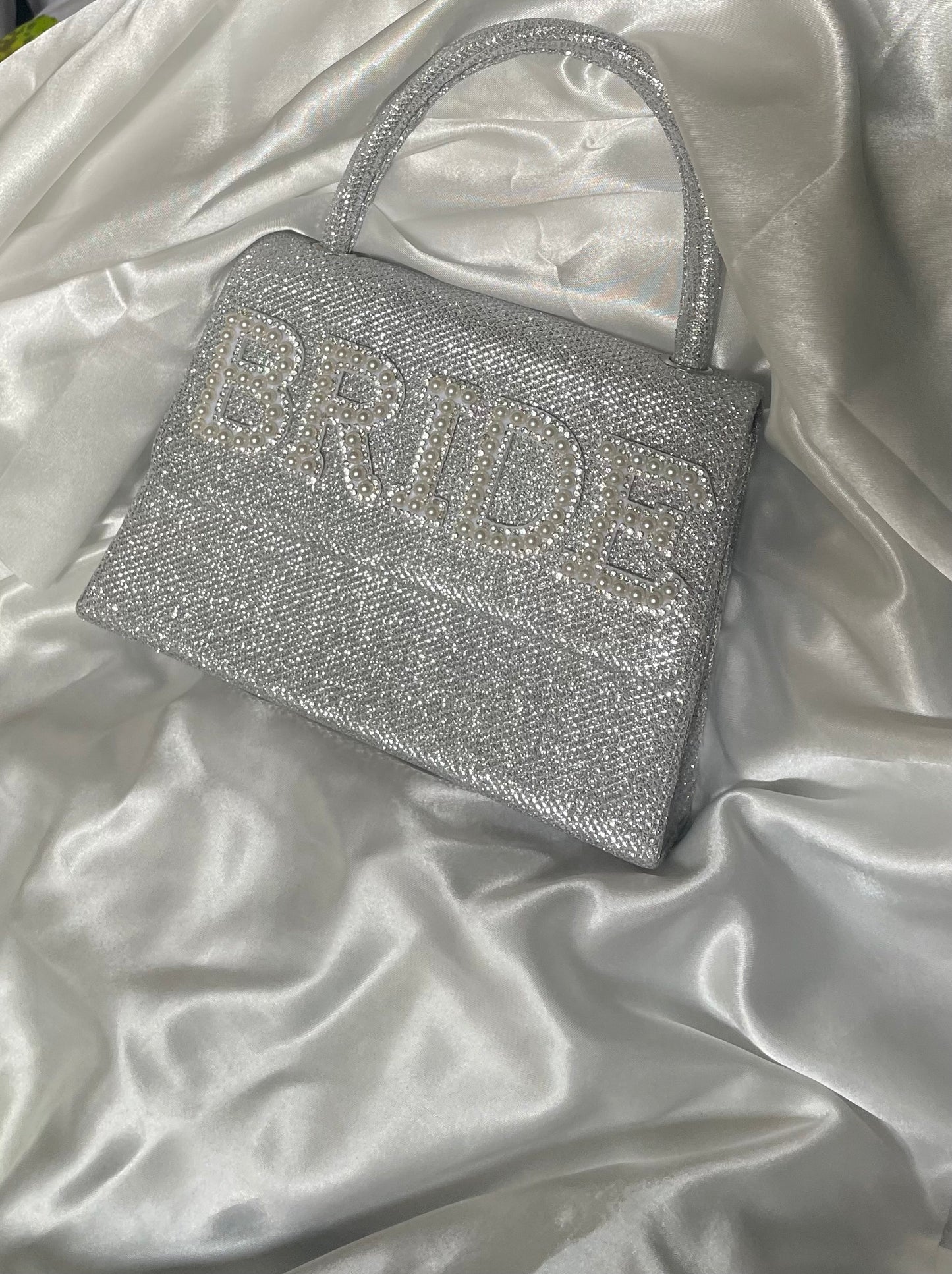 Silver glitter clutch bag