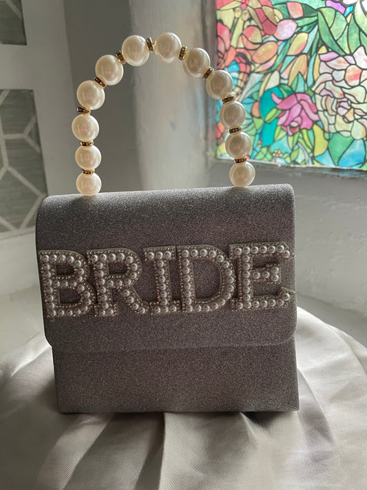 Silver glitter clutch bag