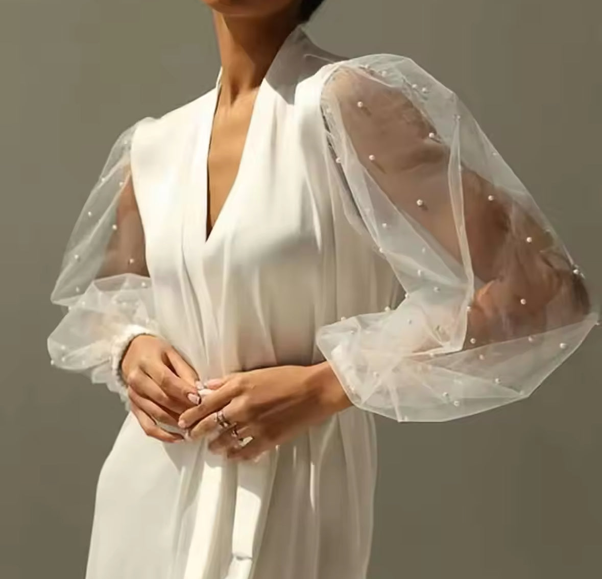 Bridal satin gown with pearl embellished sleeves