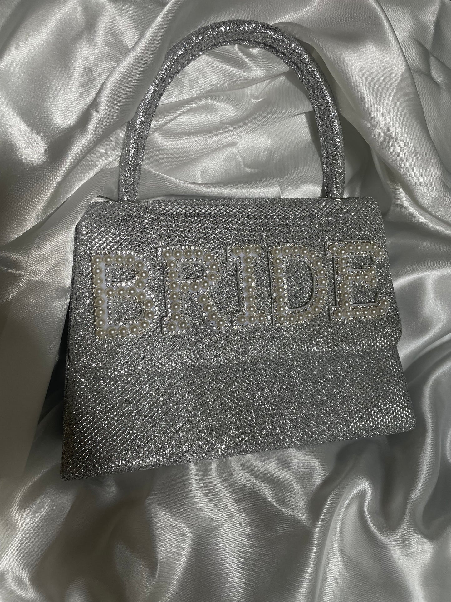 Silver glitter clutch bag